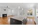 Spacious area features kitchen island, hardwood floors, and a fireplace at 2500 Everett Ave, Raleigh, NC 27607
