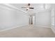 Light filled main bedroom features neutral carpet, overhead lighting and ensuite bathroom at 2500 Everett Ave, Raleigh, NC 27607