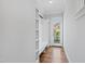 Mudroom with built-in bench, shelving, and coat hooks for organization near an exterior door at 2500 Everett Ave, Raleigh, NC 27607