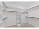 Spacious walk-in closet with multiple shelves and wooden racks at 2500 Everett Ave, Raleigh, NC 27607