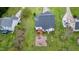 Aerial view showcases a home with deck, seating area, and a sprawling green lawn at 2709 White Rail Dr, Fuquay Varina, NC 27526