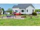 Backyard with swing set, brick patio, and plenty of space for outdoor fun against a house backdrop at 2709 White Rail Dr, Fuquay Varina, NC 27526
