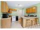 Bright kitchen with lots of counter space and wooden cabinets at 2709 White Rail Dr, Fuquay Varina, NC 27526