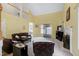 Bright living room with high ceilings, carpet flooring, a fireplace, and comfortable leather furniture at 2709 White Rail Dr, Fuquay Varina, NC 27526