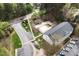 Aerial view of community featuring a pool, parking area, and landscaped grounds at 2800 Trailwood Pines Ln # 301, Raleigh, NC 27603