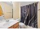 Bathroom featuring a vanity with a white sink and marble-patterned shower curtain at 2800 Trailwood Pines Ln # 301, Raleigh, NC 27603