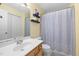 Bathroom featuring a vanity with a white sink, shelves and a shower with light-blue curtain at 2800 Trailwood Pines Ln # 301, Raleigh, NC 27603