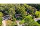 Aerial view of home showcases a well-maintained lawn, mature trees, and an inviting neighborhood at 2809 Haven Rd, Raleigh, NC 27610