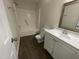 Functional bathroom with a shower-tub combo and a clean, white vanity with generous cabinet space at 2809 Haven Rd, Raleigh, NC 27610