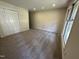 Spacious bedroom with closet and window features plush carpet flooring at 2809 Haven Rd, Raleigh, NC 27610
