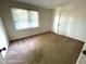 Comfortable bedroom with wall-to-wall carpet, a double door closet, and a sunlit window at 2809 Haven Rd, Raleigh, NC 27610