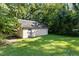 Exterior view of shed on a well maintained lawn with trees at 2809 Haven Rd, Raleigh, NC 27610
