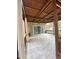 Covered back porch with gray tile and wood construction at 306 Smoketree Way, Louisburg, NC 27549