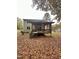 Backyard featuring covered porch with curtains and steps at 306 Smoketree Way, Louisburg, NC 27549