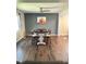 Dining room featuring dark wood table, upholstered chairs, ceiling fan, and decorative artwork at 306 Smoketree Way, Louisburg, NC 27549