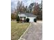 Well-kept home with a two-car garage, stone facade and a landscaped front yard with walkway at 306 Smoketree Way, Louisburg, NC 27549