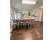 Open kitchen featuring granite counters, white cabinets and stainless steel appliances at 306 Smoketree Way, Louisburg, NC 27549