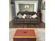 Comfortable living room with a grey reclining sofa and decorative pillows and rug at 306 Smoketree Way, Louisburg, NC 27549