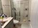 Bathroom featuring a glass-enclosed shower and modern vanity with ample storage space at 307 King Closer Dr, Cary, NC 27519