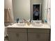 Bright bathroom featuring double sinks and large mirror at 307 King Closer Dr, Cary, NC 27519