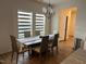Cozy dining area with modern lighting and window blinds at 307 King Closer Dr, Cary, NC 27519