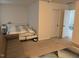 Partially furnished living room with a couch and bed visible at 307 King Closer Dr, Cary, NC 27519