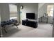 Comfortable bedroom featuring a daybed, TV, and a work desk in a bright and airy space at 316 Nickleby Way, Wendell, NC 27591