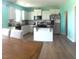 Modern kitchen featuring white cabinets, stainless steel appliances, and an island with bar seating at 316 Nickleby Way, Wendell, NC 27591