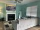 Inviting living room featuring a gray sofa, fireplace with TV, and modern decor at 316 Nickleby Way, Wendell, NC 27591