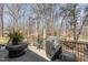 Outdoor patio area featuring a fire pit and seating, perfect for enjoying the surrounding nature at 316 Pebble Beach Dr, Mebane, NC 27302