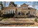 A beautiful backyard features a stone patio and garden area, perfect for outdoor entertaining and relaxation at 316 Pebble Beach Dr, Mebane, NC 27302
