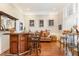 Open concept room with a bar and lounge seating provides ideal space for relaxing or entertaining at 316 Pebble Beach Dr, Mebane, NC 27302