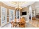 Cozy breakfast area with a chandelier, a wooden table, and access to outdoor area, perfect for morning meals at 316 Pebble Beach Dr, Mebane, NC 27302