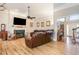 Comfortable living room with a fireplace, and a large TV, perfect for relaxing with Gathering and friends at 316 Pebble Beach Dr, Mebane, NC 27302