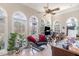 Bright home office features arched windows, comfortable seating, and ample desk space, ideal for remote work at 316 Pebble Beach Dr, Mebane, NC 27302