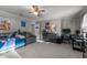 Comfortable bedroom featuring carpet, ceiling fan, and space for a desk or seating area at 347 Cook Rd, Elon, NC 27244