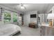 Bright bedroom with natural light, complemented by a large mirror, closet, and ample storage at 347 Cook Rd, Elon, NC 27244