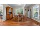 Traditional dining room features hardwood floors, natural light and classic wood furniture at 347 Cook Rd, Elon, NC 27244