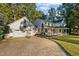 Charming home with an attached garage, long driveway, welcoming front porch, and curb appeal at 347 Cook Rd, Elon, NC 27244
