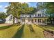 Charming home with a welcoming front porch and attached garage, situated on a spacious lot at 347 Cook Rd, Elon, NC 27244