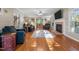 Cozy living room has hardwood floors, a fireplace, comfortable furniture and plenty of natural light at 347 Cook Rd, Elon, NC 27244