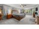 Spacious main bedroom featuring hardwood furniture, natural light, and a cozy seating area at 347 Cook Rd, Elon, NC 27244
