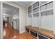 Organized mudroom area with built-in shelving, hooks, and storage baskets for convenience at 347 Cook Rd, Elon, NC 27244