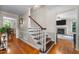 Elegant staircase with hardwood treads and white risers leading to the upper level of the home at 347 Cook Rd, Elon, NC 27244