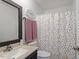 Bathroom with a vanity and patterned shower curtain at 3490 Old Buies Creek Rd, Angier, NC 27501