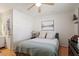 Comfortable bedroom with hardwood floors and a ceiling fan at 3490 Old Buies Creek Rd, Angier, NC 27501