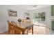 Cozy dining area with hardwood floors and sliding glass doors to the outside at 3490 Old Buies Creek Rd, Angier, NC 27501