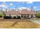Charming ranch-style home with a cozy front porch and well-maintained landscaping, set against a blue sky backdrop at 3490 Old Buies Creek Rd, Angier, NC 27501