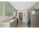 Stylish kitchen with updated appliances and ample counter space leading into the laundry area at 3490 Old Buies Creek Rd, Angier, NC 27501