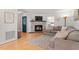 Cozy living room with a brick fireplace, television, and comfortable seating area at 3490 Old Buies Creek Rd, Angier, NC 27501